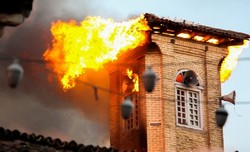 Minaret of Sari historical mosque is seen on fire, July 12, 2018.