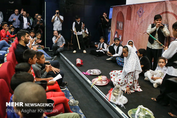 Iran's goal keeper watches World Cup final with teen workers