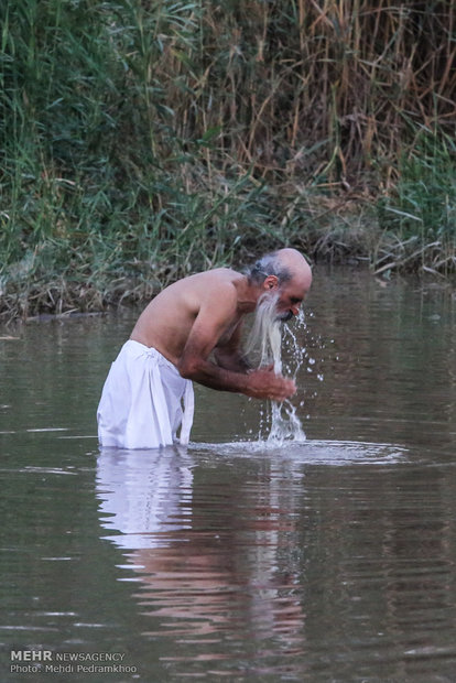 Mandaeans performing baptism in Karun River