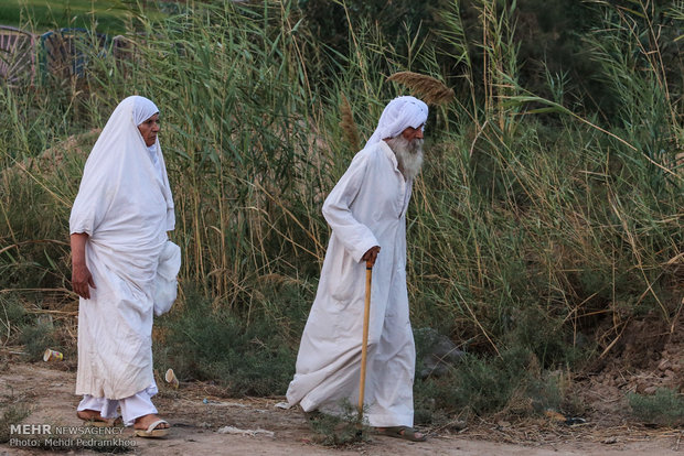 Mandaeans performing baptism in Karun River