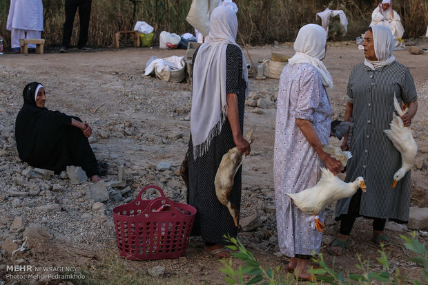 Mandaeans performing baptism in Karun River