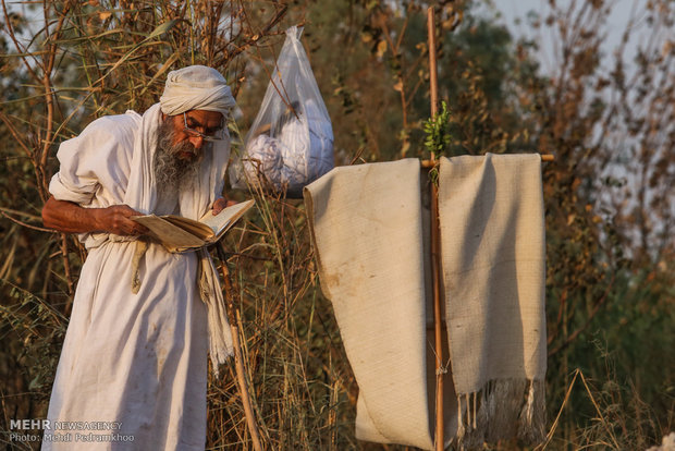 Mandaeans performing baptism in Karun River