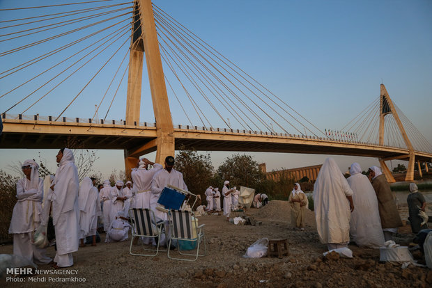 Mandaeans performing baptism in Karun River