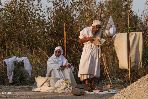 Mandaeans performing baptism in Karun River