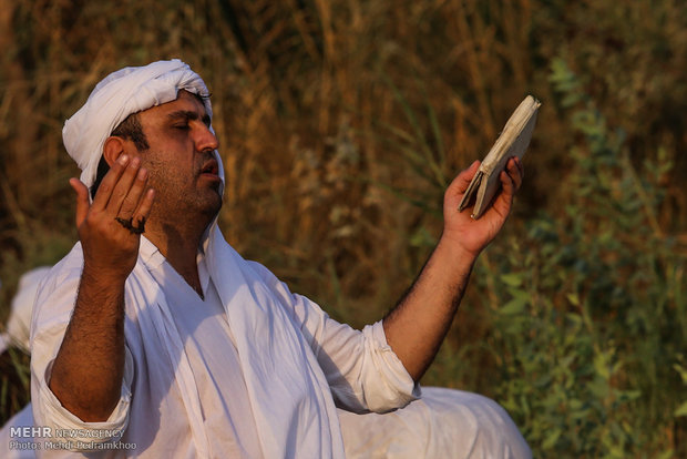 Mandaeans performing baptism in Karun River