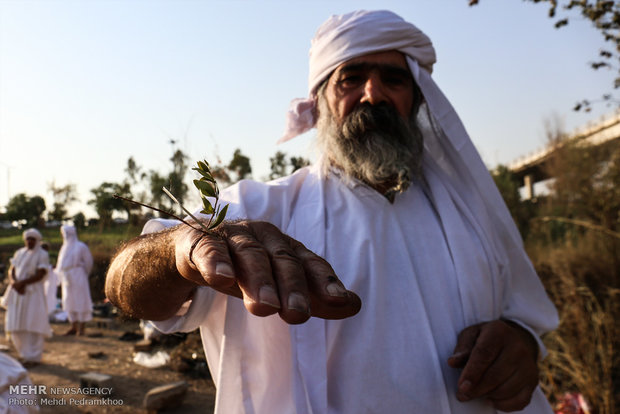 Mandaeans performing baptism in Karun River