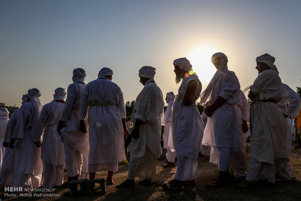 Mandaeans performing baptism in Karun River