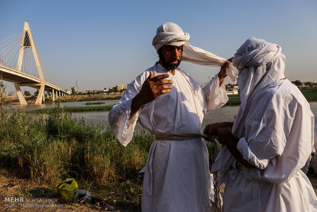 Mandaeans performing baptism in Karun River