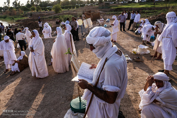 Mandaeans performing baptism in Karun River