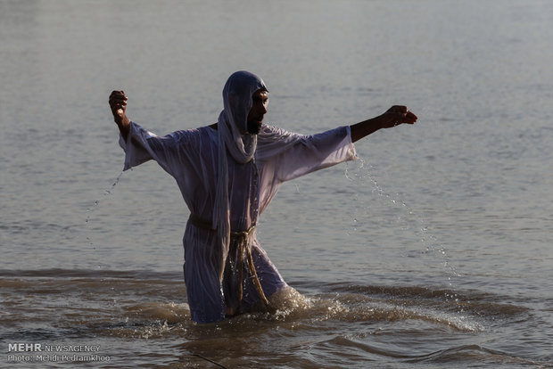 Mandaeans performing baptism in Karun River