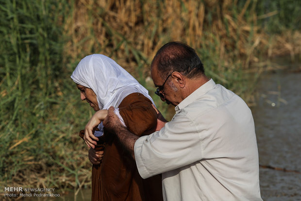 Mandaeans performing baptism in Karun River