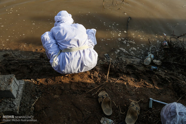 Mandaeans performing baptism in Karun River