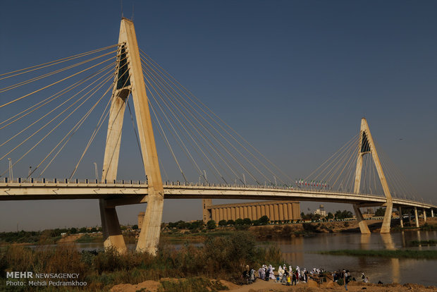 Mandaeans performing baptism in Karun River