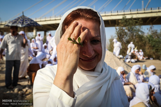 Mandaeans performing baptism in Karun River