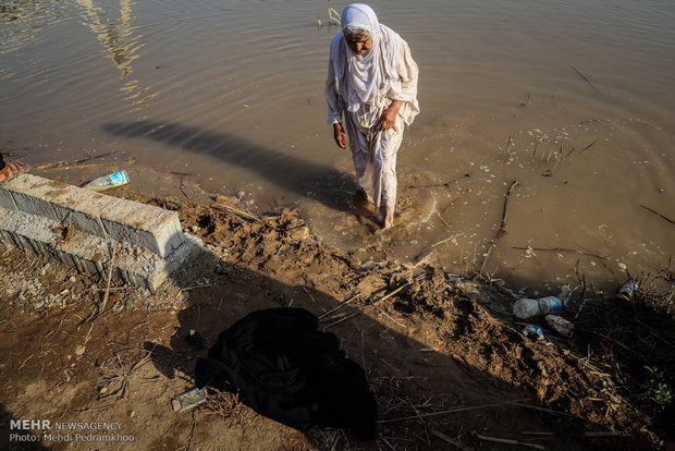 Mandaeans performing baptism in Karun River