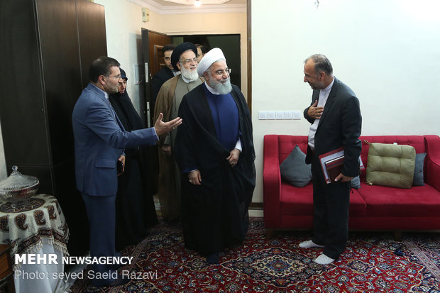 President Rouhani visits a war veteran