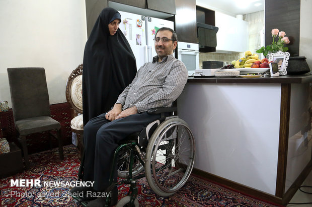 President Rouhani visits a war veteran