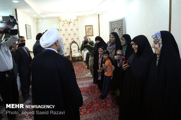 President Rouhani visits a war veteran