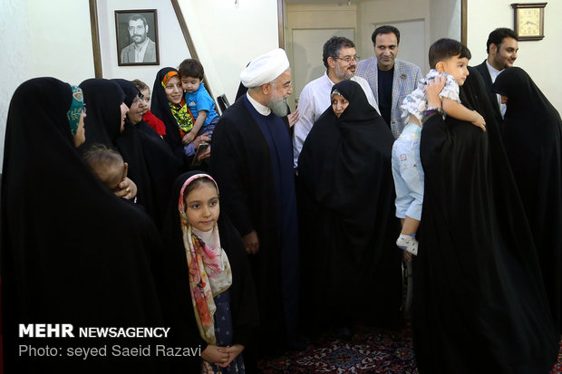 President Rouhani visits a war veteran