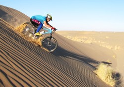 Iranian cyclist Hassan Khorashadi rides across the Lut Desert in an undated photo.
