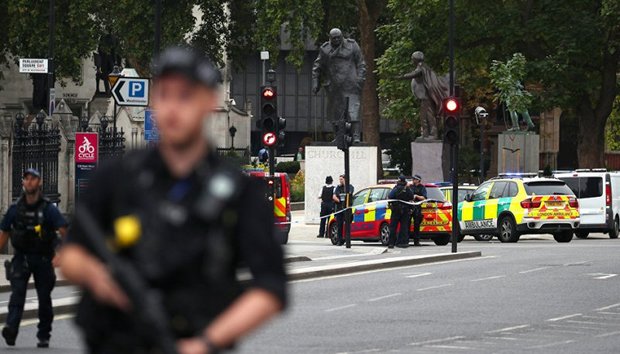 Car smashes into security barriers outside UK parliament, driver detained