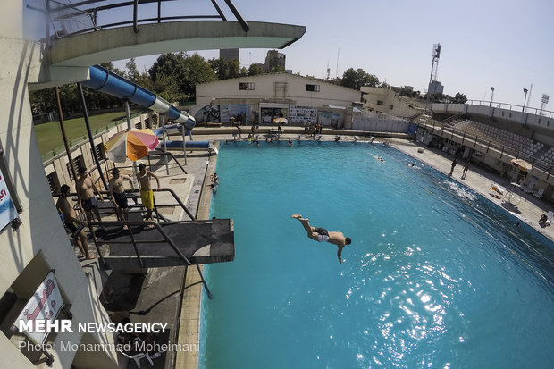 Tehraners enjoy an outdoor swimming pool