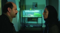 Ali Mosaffa and Hedyeh Tehrani act in a scene from “Orange Days” by Arash Lahuti.