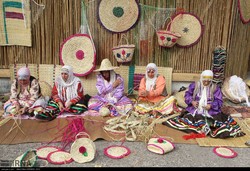 Iranian craftswomen weave traditional baskets during a national mat weaving festival at Fashtakeh village, Gilan province on September 6, 2018.
