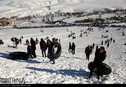 People are snow tubing on the hills in Ardebil, northwest Iran, in February 2017 (Photo by Mohammad Zare/ IRNA)