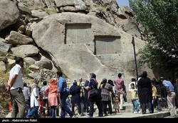People visit Ganjnameh tourist resort complex in Hamedan province.  The site is home to Achaemenid-era rock carvings and natural attractions.