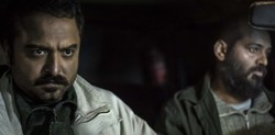 Babak Behshad (L) and Nader Fallah act in a scene from “Birthday Night” by Omid Shams.