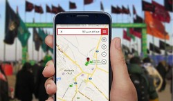 An Arbaeen pilgrim navigates shrine of Ima Hussain (AS) on the cellphone