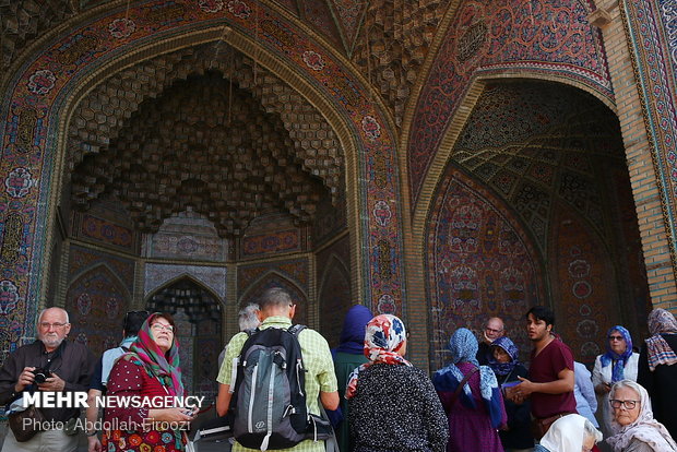 Autumn tourists visiting Nasir al-Molk Mosque in Shiraz