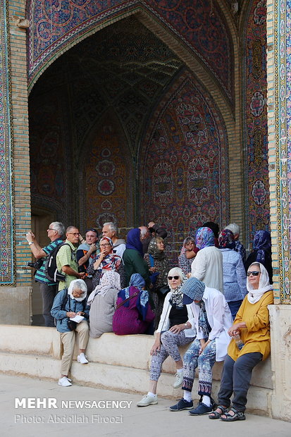 Autumn tourists visiting Nasir al-Molk Mosque in Shiraz