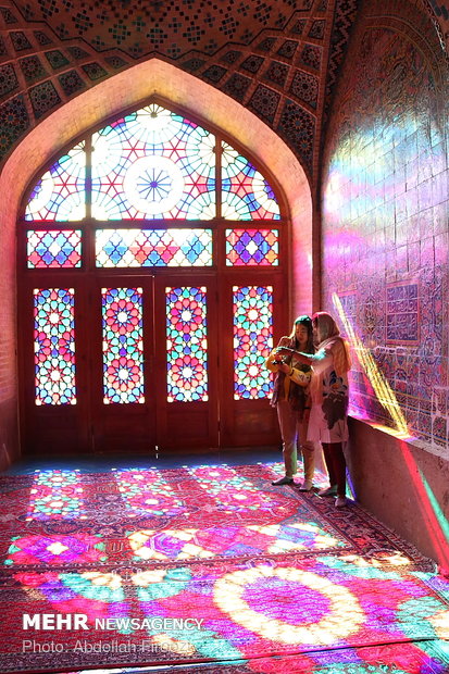 Autumn tourists visiting Nasir al-Molk Mosque in Shiraz