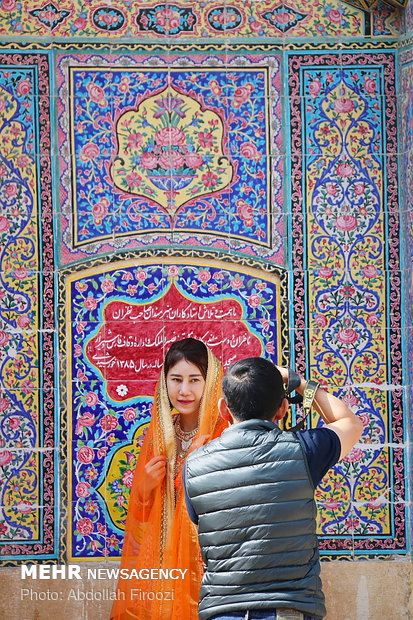 Autumn tourists visiting Nasir al-Molk Mosque in Shiraz
