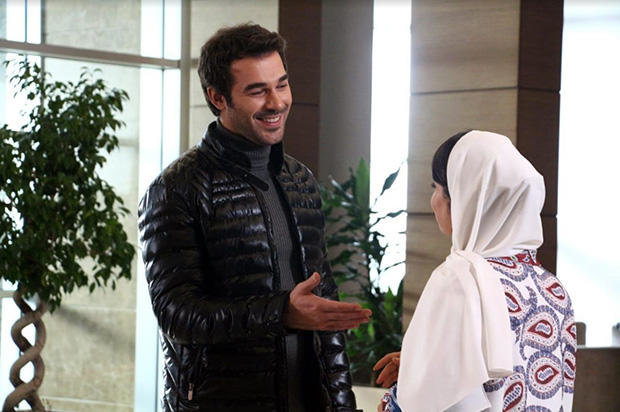 Turkish star Yusuf Çim (L) and Iranian actress Afsaneh Pakru act in a scene from “Sing Me a Love Song” by Iranian director Mehrdad Ghaffarzadeh.