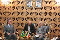 Iranian Economy Minister Farhad Dejpasand (R) held talks with Fernando Affonso Collor de Mello, the former Brazilian president and the chairman of the Brazilian Parliament’s Foreign Affairs Committee (L) in Tehran on Monday.