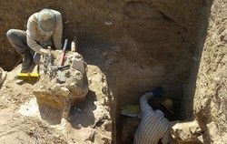 Workmen are seen in an archaeological trench in Bazeh Hoor, northeast Iran.