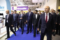 Iran’s Minister of Information and Communication Technology (ICT) Mohammad Javad Azari Jahromi (2nd from r) and his Azeri counterpart Ramin Guluzade (3rd from r) visit Bakutel 2018, which was held fro