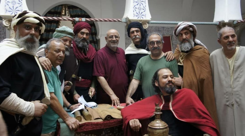 Cast and crew members of “Ahmed Bey” pose with director Jamal Shurjeh (5th L) in Algiers in an undated photo.
