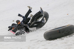 Snow tubing fun in central Iran
