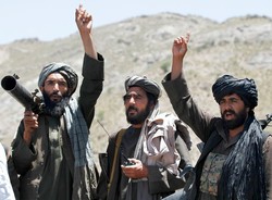 In this May 27, 2016, file photo, Taliban fighters react to a speech by their senior leader in the Shindand district of Herat province, Afghanistan. (Allauddin Khan/AP)