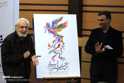 Actor Jamshid Mashayekhi (L) and the president of the 37th Fajr Film Festival, Ebrahim Darughezadeh, are seen after unveiling the official poster of the event in Tehran on January 4, 2019. (Mehr/Moham