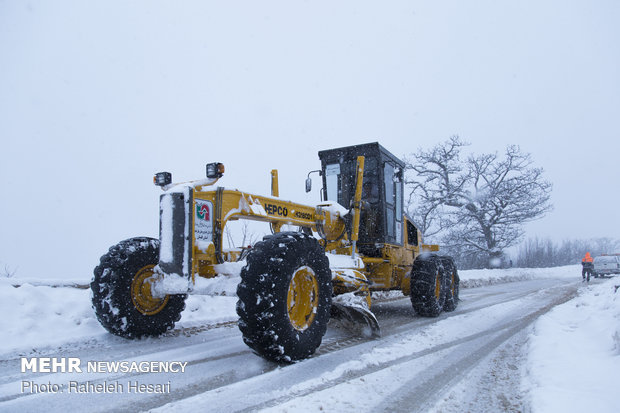 Snowplow crews clear snow rom Golestan province's roads