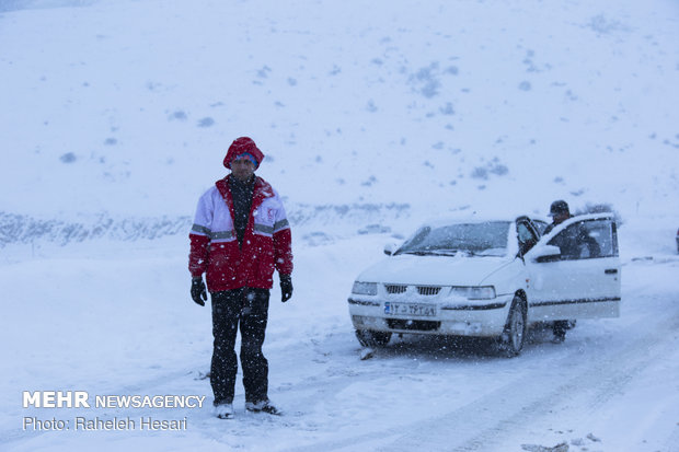 Snowplow crews clear snow rom Golestan province's roads