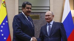 Vladimir Putin and Nicolás Maduro