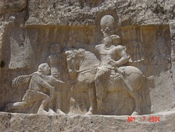 A bas-relief carving at Naqsh-e Rostam depicts the triumph of Shapur I over the Roman emperors Valerian and Philip the Arab.