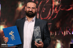 Producer Mohammad-Hossein Qasemi accepts the Crystal Simorgh for best film for “The Night When the Moon Was Full” during the 37th Fajr Film Festival at Tehran’s Milad Tower on February 11, 2019.