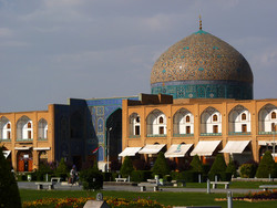 A cyclist rides in front of the Sheikh Lotfollah Mosque, a 17th century architectural masterpieces of Iranian architecture that punctuates two-story arcades of the UNESCO-registered Imam Square, in Isfahan, central Iran.
